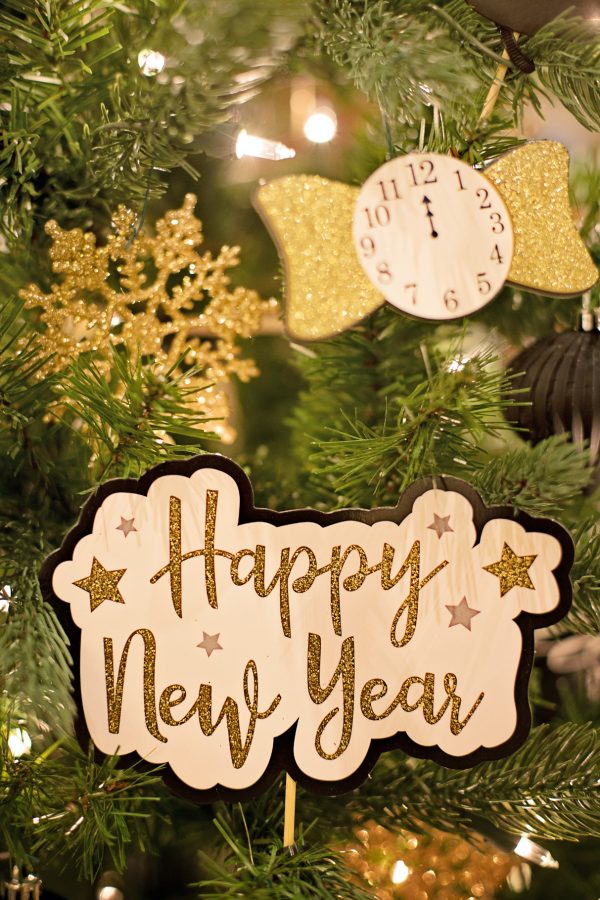 Happy New Year Card with ornaments in a tree